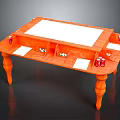 Orange Table With White Top Decorative Legs And Storage Compartments For Small Items