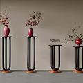 Black Flower Stands With Wooden Base Red Vases And Plants With Red White Blooms