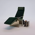 Green Velvet Chaise Lounge With Metal Frame And Side Book Rack Holding Books