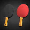 Two Table Tennis Rackets With Black Red Faces And Yellow Handles With Stars