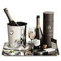 Elegant Wine Bottles And Glasses With Silver Ice Bucket And Sternberg Accessories On Tray