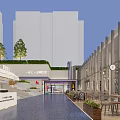Vibrant Modern Commercial Street With Outdoor Seating Greenery Shops And Evening Pedestrians