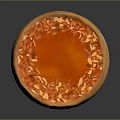 Smooth Round Dessert With Orange Top And Nut Sprinkles On Light Brown Base 3d model