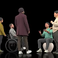 Group of People Interacting with One in Wheelchair and Another on Exercise Ball