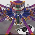 Vibrant Amusement Ride With Spinning Arms Passenger Seats Staircase And Safety Railing