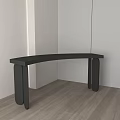 Black Curved Side Table With Modern Design On Wooden Floor And White Walls
