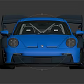 Shiny Blue Sports Car With Large Rear Spoiler And Wide Body Kit