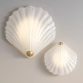 Elegant Shell Shaped White Glass Wall Sconce With Golden Ball Accent For Interior Lighting