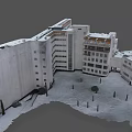 Aerial View of Snow Covered Building Complex with Tower and Parking Lot