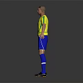 Brazilian Football Player In Yellow Jersey And Blue Shorts With Number 9 Standing On Gray Background