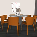Modern Round Dining Table Set With Orange Chairs And Decorative Wall Art 3d model