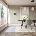 Light Gray Upholstered Dining Chairs With Black Metal Legs By Wooden Round Table And Vase