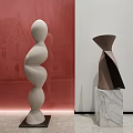 White Spiral And Brown Black Geometric Sculptures On Marble And Black Bases In Gallery