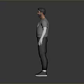 Man in Gray T-shirt With Graphic Black Pants White Long Sleeves and Black Shoes