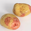 Fresh Two Yellow And Red Spotted Potatoes On White Background