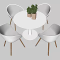 Modern Dining Table Set With White Round Table Colorful Chairs Wooden Legs And Potted Plants