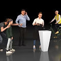 Group of People in Action with White Pedestal Riding Bicycle Using Tablet and Talking
