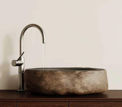 Natural Stone Washbasin With Silver Curved Faucet On Wooden Countertop Against Light Colored Wall 3d model