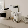 Modern White Kitchen Countertop With Kitchen Appliances Rice Cooker Water Dispenser And Cup Holder