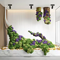 Indoor Landscape Featuring Sculptural Green and Purple Plants with Wooden Accents and Marble Base