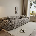 Comfortable Gray Textured Sectional Sofa in Bright Living Room with Floor Lamp and Wall Art