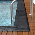 Modern Swimming Pool Area With Clear Blue Water Metal Handrails And Black Deck