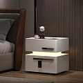 Modern White Bedside Table In Bedroom With Drawers And Built in Lighting Next To Bed