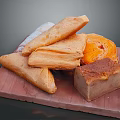 Freshly Baked Flaky Pastries and Assorted Bread Loaves on Wooden Board