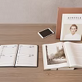 Kinfolk Lifestyle Magazine And Open Notebook On Wooden Desktop With Pen