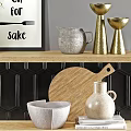 Modern Kitchen Cabinets with Black Tiled Wall Decorative Vases Green Plants Bowls and Wooden Board