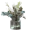 Elegant Transparent Glass Vase With Green Gray Blue Foliage Arrangement