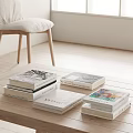 Stacks of Books and Magazines on Wooden Coffee Table With Various Cover Designs