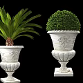 Ornate White Decorative Planters With Green Topiary And Palm Plant