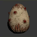 Artistic Egg Shaped Sculpture Carving with Red Spots Spikes and Textured Surface