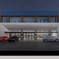 Illuminated 4S Dealership Exterior At Night With Parked Cars Near Entrance