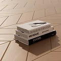 Stack of Books and Magazines on Geometric Pattern Wooden Floor