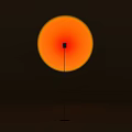 Floor Lamp With Orange Circular Lampshade Black Small Square And Slender Pole On Dark Background