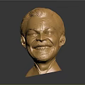 Detailed Golden Human Head Sculpture With Shiny Metallic Surface And Smiling Expression