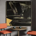 Orange Bar Stools With Black Metal Legs By Round Table And Abstract Painting On Gray Wall