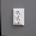 White Double Electrical Socket Mounted On Gray Wall For Home Electrical Use