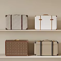 Vintage Suitcases with Gray White Brown Beige Tones and Decorative Trim Handles Displayed on Shelves