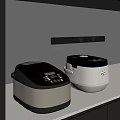 Two Modern Black And White Rice Cookers As Key Kitchen Appliances On Countertop