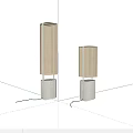 Two Modern Table Lamps With Fabric Shades And Metal Wood Bases On Dark Background