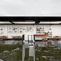Open Space Café With Large Windows Wooden Tables Bicycle Decor And Green Plants
