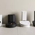 Smart Machines Featuring Robotic Vacuum Cleaners And Charging Bases In White And Black