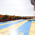 Fun Playground With Colorful Climbing Wall Rope Ladder Glass Walls And Soft Mats For Kids