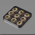 Eight Stuffed Mushrooms on Black Tray Topped with Fresh Green Herbs