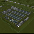 Aerial View of Modern Industrial Factory Complex With Multiple Buildings Green Surroundings And Roads