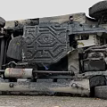View Of Overturned Car Exposed Underbody With Damaged Mechanical Structure