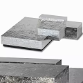 Silver Textured Metal Blocks Stacked With Layered Structure And Smooth Surfaces
